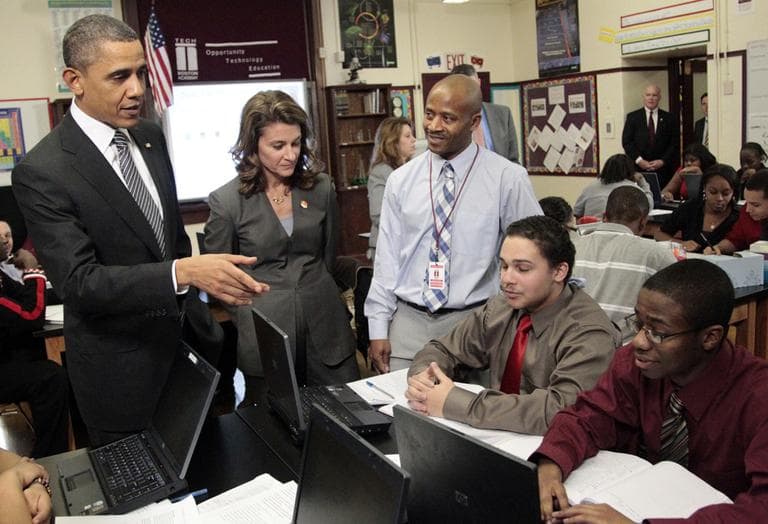 President Obama talks to students during his visit to TechBoston Academy in Dorchester Tuesday. Melinda Gates and teacher James Lewis join the president. (AP)