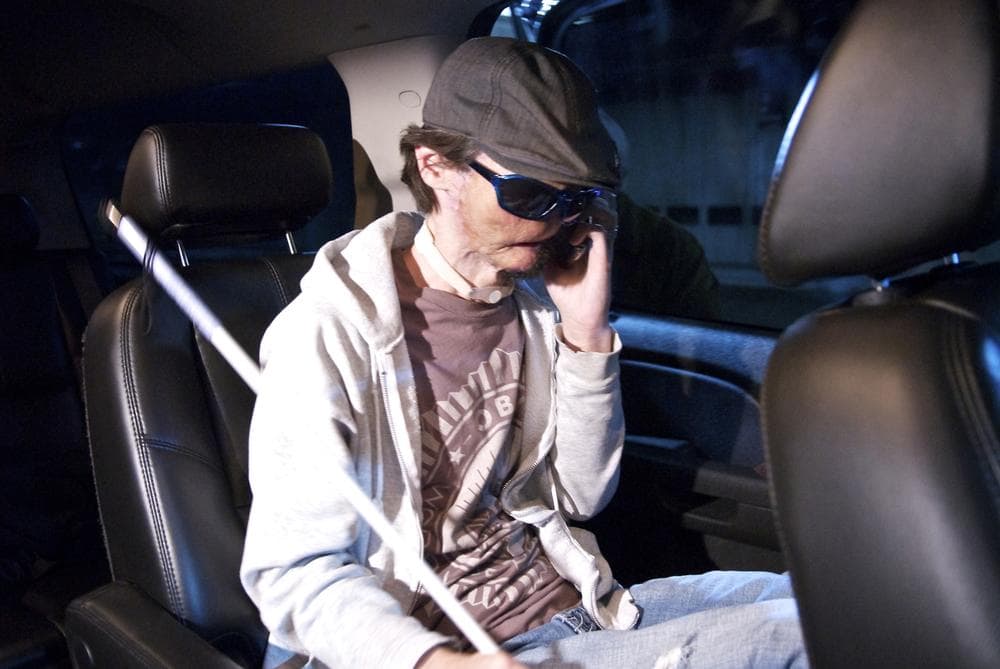 Dallas Wiens talks on his cell phone while on his way to Brigham and Women’s Hospital. (Lightchaser Photography/J. Kiely Jr.)