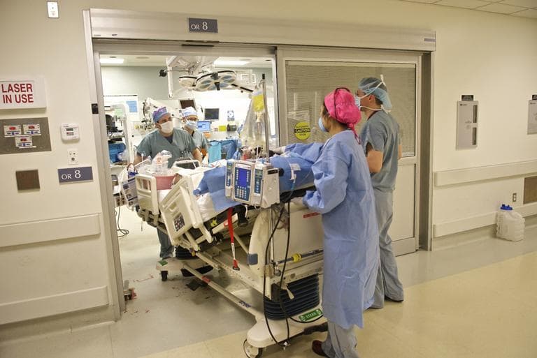 After a successful surgery, staff take Wiens from the operating room to his room. (Lightchaser Photography/J. Kiely Jr.)
