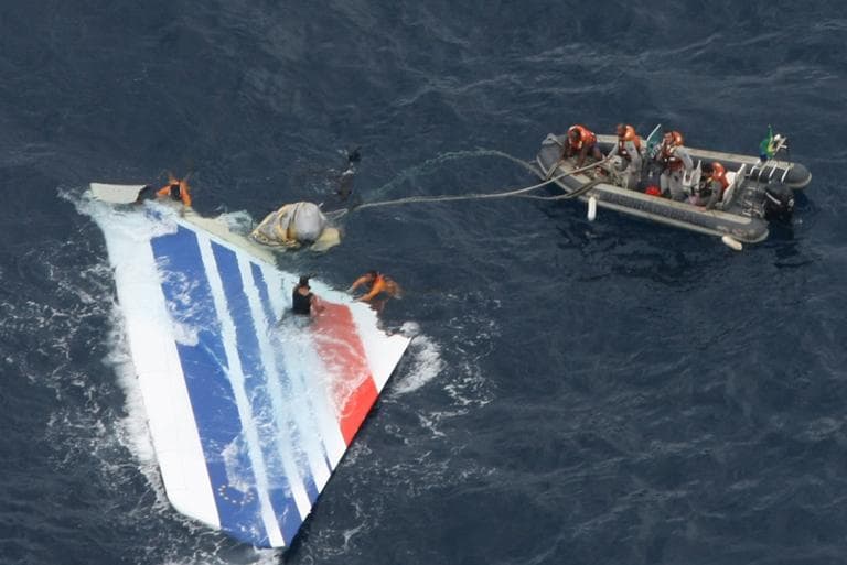 In this June 2009 file photo released by Brazil's Air Force, Brazil's Navy sailors recover debris from the missing Air France Flight 447 in the Atlantic Ocean. (AP)