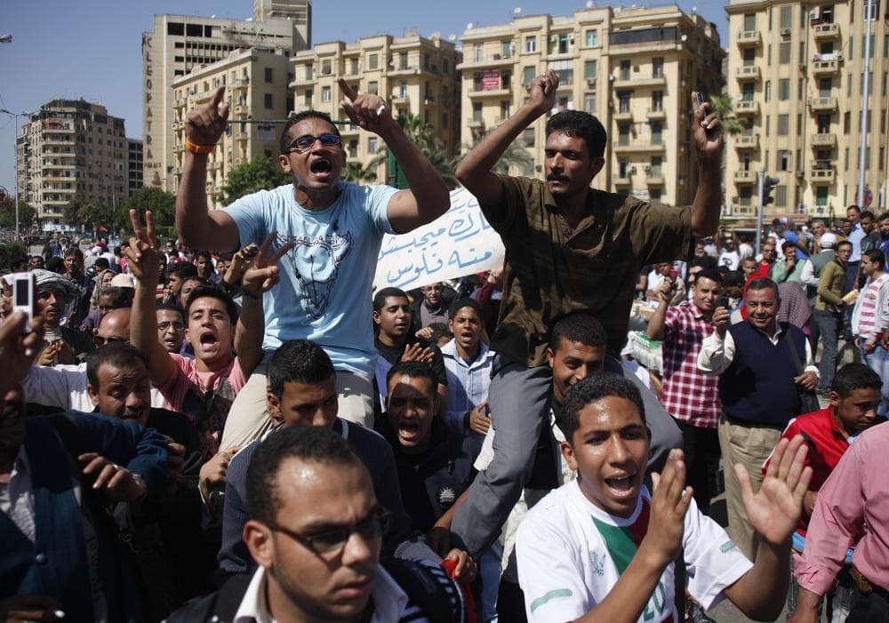 Egyptians shout anti- Mubarak slogans during their protest at Tahrir Square in Cairo, Egypt, April 10, 2011. Former Egyptian President Hosni Mubarak is denying that he abused his authority to amass wealth and property in his first speech since his ouster. Arabic reads "we need our money from Mubarak." (AP)