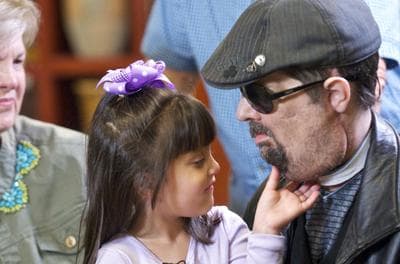 Scarlette Wiens touches the chin of her father, face-transplant recipient Dallas Wiens. (Lightchaser Photography/Brigham and Women's Hospital)