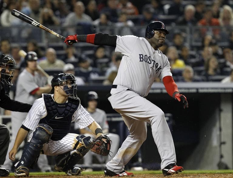 Boston Red Sox designated hitter David Ortiz hits a solo home run off New York Yankees starting pitcher Freddy Garcia, Sunday. (AP)