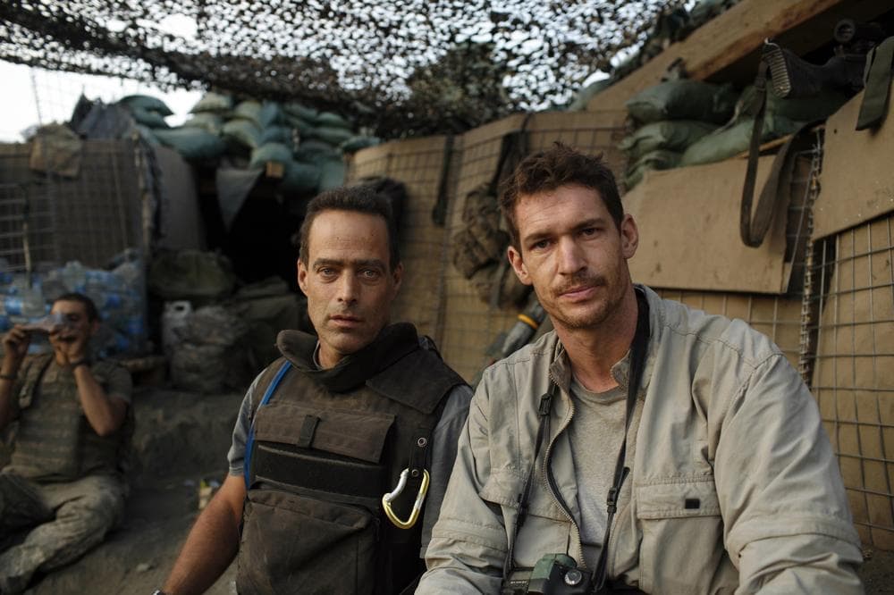 Directors and journalists Sebastian Junger, left, and Tim Hetherington are shown at the Restrepo outpost in the Korengal Valley, Afghanistan, during the filming of their documentary  "Restrepo". Hetherington was recently killed while reporting from Libya. (AP/Outpost Films/Tim Hetherington)