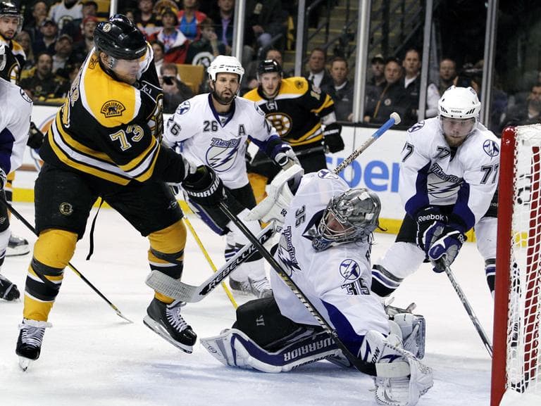 Boston Bruins right wing Michael Ryder (73) scores against Tampa Bay Lightning goalie Dwayne Roloson (35) as defenseman Victor Hedman (77) and right wing Martin St. Louis (26) try to defend in the second period of Game 2 of the NHL hockey Stanley Cup Eastern Conference final playoff series in Boston Tuesday, May 17, 2011. (AP Photo/Elise Amendola)