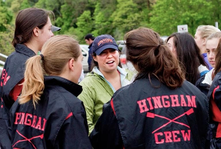 Kim Laughlin, center, speaks to her Hingham High School crew teammates. She doesn't think MCAS scores should factor into teacher evaluations. (Jesse Costa/WBUR)