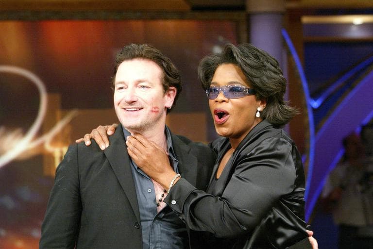 Bono, left, appeared on "The Oprah Winfrey Show" in 2002. ((c) Harpo, Inc./George Burns)