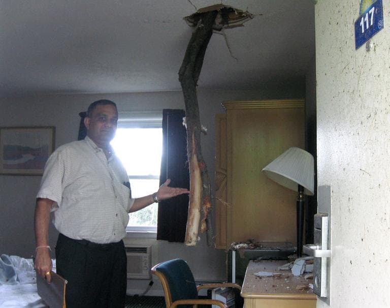 Days Inn owner Jay Patel shows off the only motel room he's looked in so far &mdash; he's waiting for the insurance company for the rest. (Sacha Pfeiffer/WBUR)