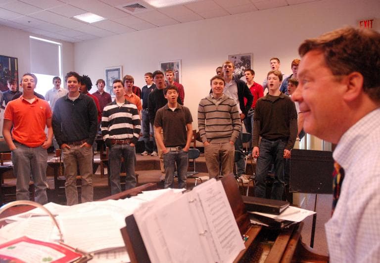 Roxbury Latin Headmaster Kerry Brennan, right, leads the school's glee club. (Andrea Shea/WBUR)