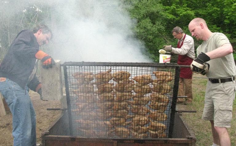 Volunteers roast chicken for the Mont Vernon Congregational Church BBQ at the town's Spring Gala. (Fred Thys/WBUR)