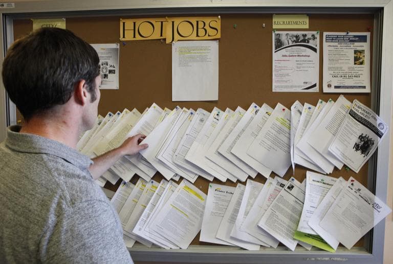 An unidentified job seeker looks for an auto mechanic job opportunity at the Verdugo Job Center in Glendale, Calif. The unemployment rate is now above 9 percent. (AP)