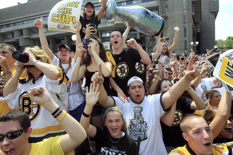 Crowds lined Boston's downtown streets Saturday for the Bruins "rolling rally" celebration. (AP)