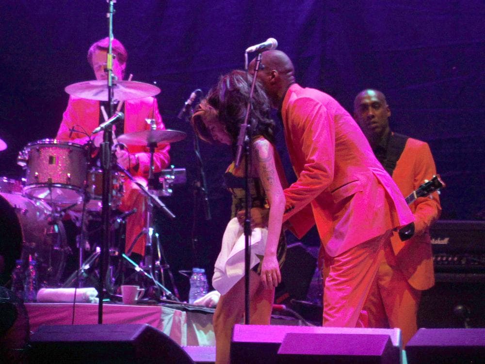 In this image taken Saturday, June 18, 2011 British singer Amy Winehouse performs on stage during her concert in Belgrade Serbia. Winehouse was booed and jeered during a concert in Serbia's capital as she stumbled onto the stage, mumbled through her songs and wandered off. (AP)