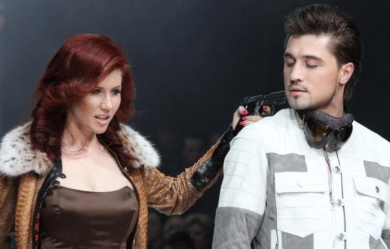 Anna Chapman hasn’t exactly kept a low profile since she was deported from the U.S. on espionage charges. Here, she poses with Russian pop singer Dima Bilan during Fashion Week in Moscow, Russia. (AP)