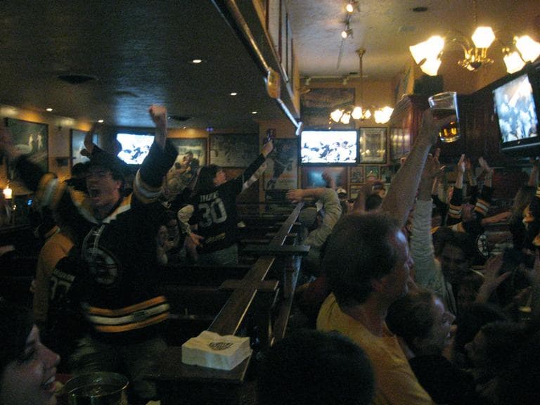 Fans celebrate inside The Four's bar on Canal Street in Boston. (Curt Nickisch/WBUR)