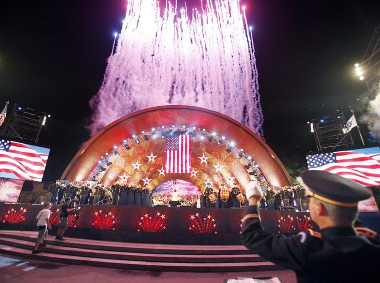 Fireworks shoot skyward behind the Hatch Shell during the Boston Pops 4th of July concert rehearsal in Boston, Sunday. (AP)