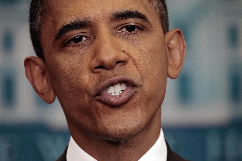 President Obama answers questions on the ongoing budget negotiations during a press conference Friday. (AP)