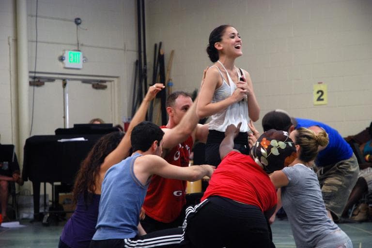 Gross and castmembers rehearse a scene from "Tarzan." (Andrea Shea/WBUR)