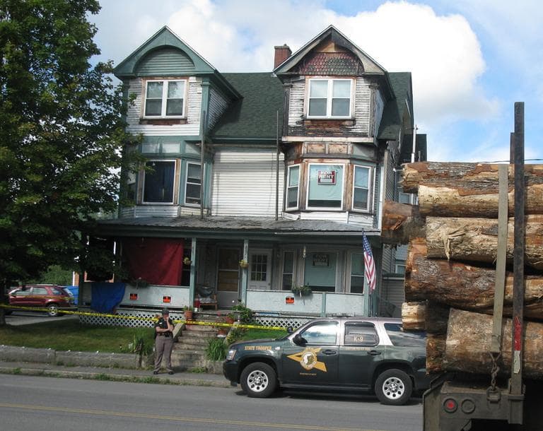 Police watch over the house where Celina Cass lived. (Fred Thys/WBUR)