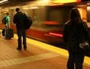 Patrons wait for the T in Cambridge's Central Square. (b a r t/Flickr)
