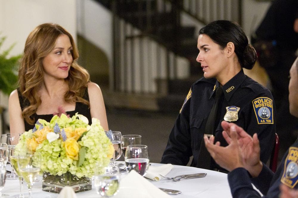 In this publicity image released by TNT, Sasha Alexander, left, and Angie Harmon are shown in a scene from the series "Rizzoli &amp; Isles." (AP)