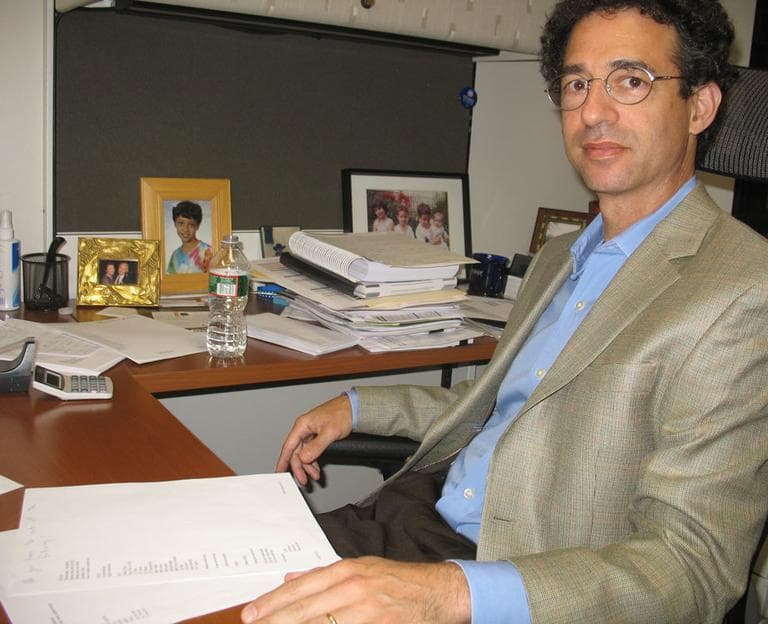 Dr. Richard Parker reviews a medical price list created for doctors at Beth Israel Deaconess Medical Center. (Martha Bebinger/WBUR)