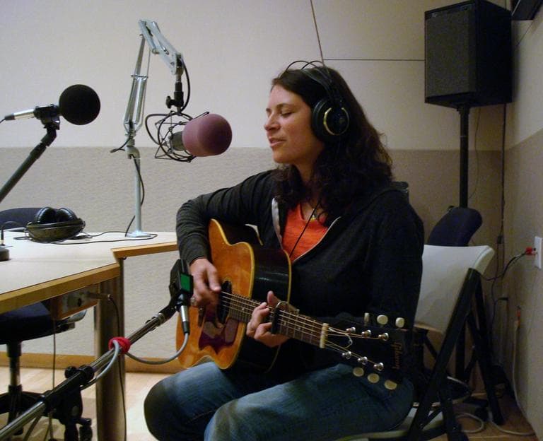 Kris Delmhorst gets ready to perform in Radio Boston's Studio 3. (Adam Ragusea/WBUR)