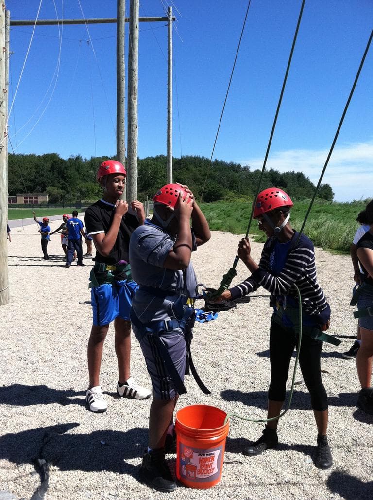 Quishawn Gilliame learns how to walk on a tightrope. (Delores Handy/WBUR)