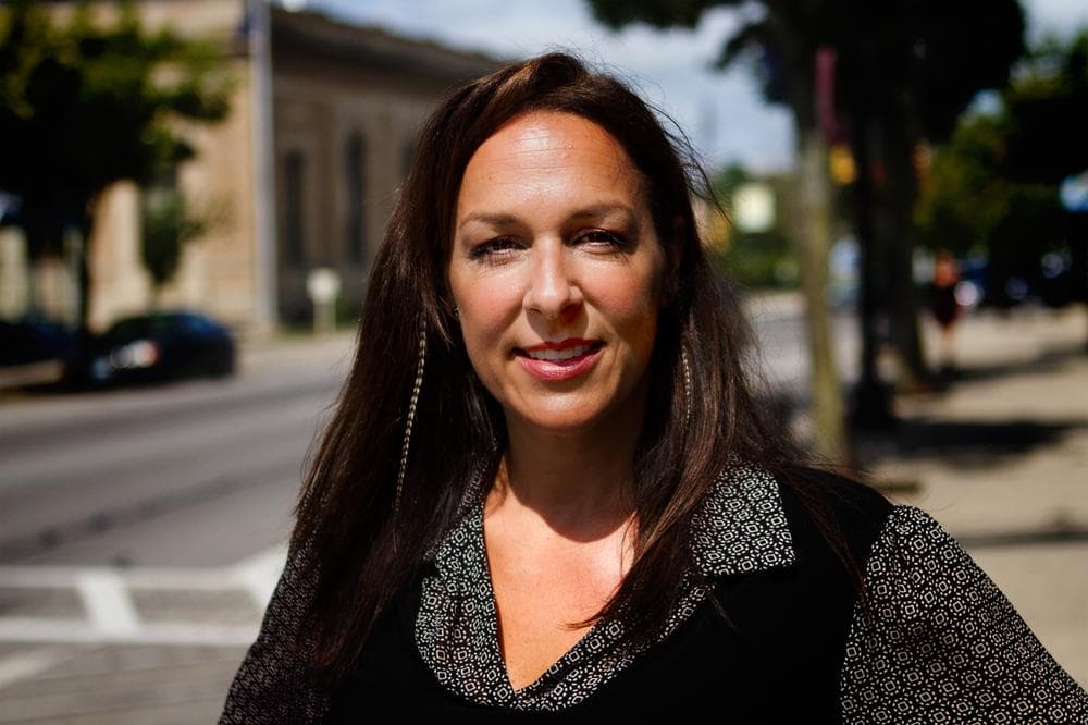 Nettie Fiorini, 6th-grade special education teacher, stands in downtown Rochester, N.H. She hopes soon to open a Biker Café. (Jesse Costa/WBUR)