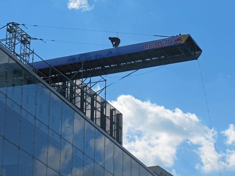 A worker prepares the diving platform. (Karen Given/WBUR)