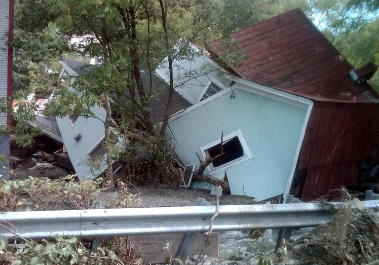 A house destroyed by Tropical Storm Irene sits on its side in Rochester, Vt. (AP)