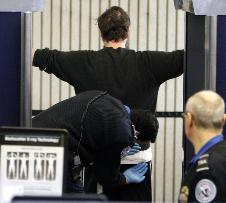 A passenger receives a pat down at a security checkpoint at Logan International Airport in Boston. (AP)
