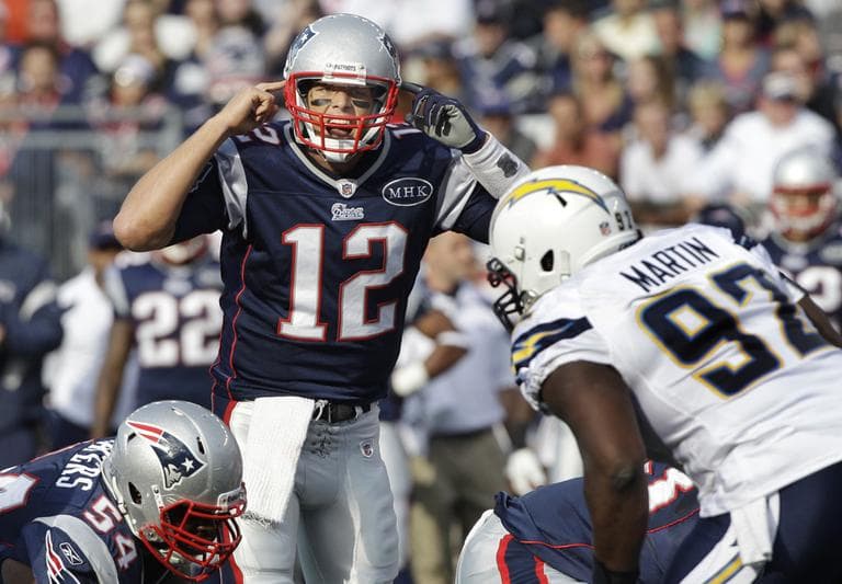 New England Patriots quarterback Tom Brady (12) yells at the line of scrimmage as San Diego Chargers defensive tackle Vaughn Martin (92) prepares for the hike during the first half of an NFL game Sunday. (AP)
