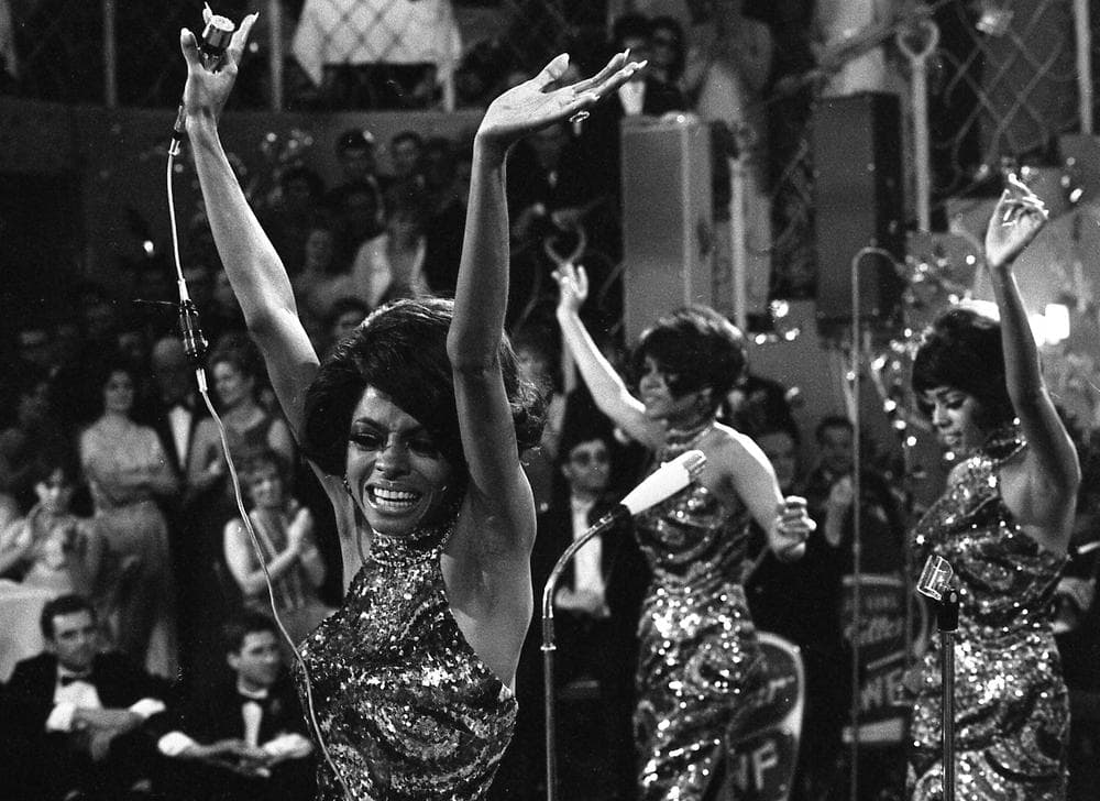 The Supremes with Diana Ross, front, Cindy Birdsong and Mary Wilson dance with their arms in the air as they perform in 1968. (AP/Frings)