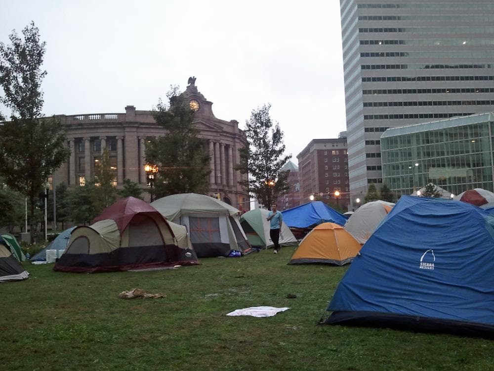 "Occupy Boston" protesters waking up in Dewey Square, outside of South Station, on Saturday. (Kathleen McNerney/WBUR)