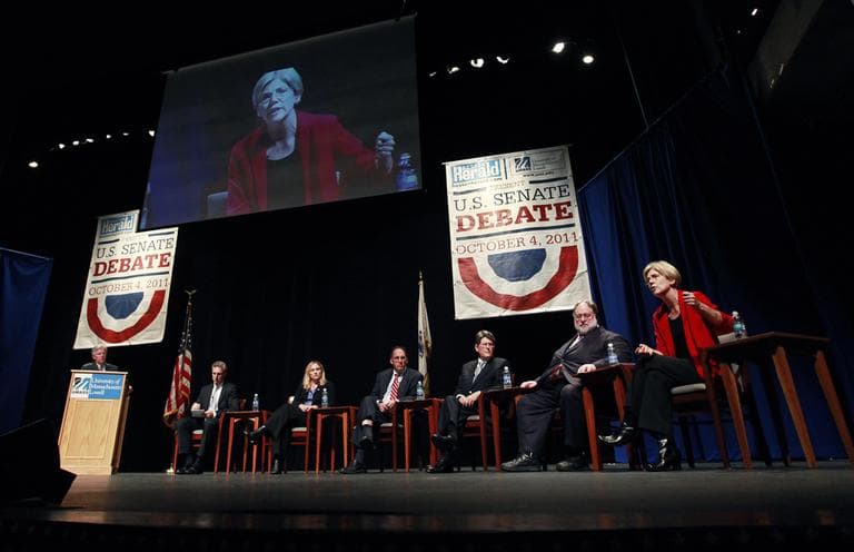 Elizabeth Warren, far right, speaks while fellow debaters listen, from left, Tom Conroy, Marisa DeFranco, Alan Khazei, Robert Massie and Herbert William Robinson in Lowell, Mass. Tuesday. (AP)