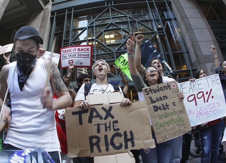Occupy Boston protesters rally in front of a building in Boston's financial district Wednesday. (AP)