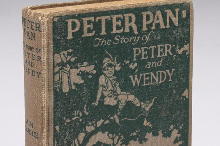 This photo released by Julien's Auctions shows a 1911 Grosset and Dunlap edition of "Peter Pan: The Story of Peter and Wendy," by J.M.Barrie, with embossed cover and scenes from the photoplay featuring Betty Bronson. (AP)