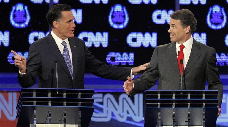 Republican presidential candidates former Massachusetts Gov. Mitt Romney, left, and Texas Gov. Rick Perry spar during a Republican presidential debate on Tuesday. (AP)
