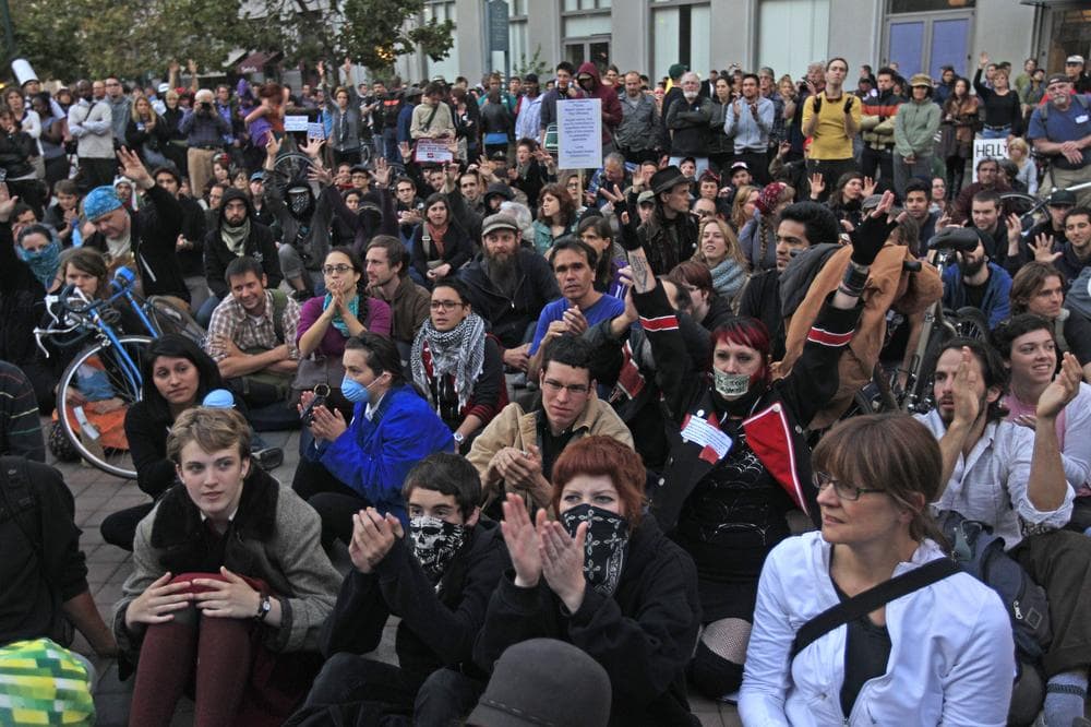 Protesters stage a sit in at Frank Ogawa Plaza, Wednesday, in Oakland, Calif. (AP)