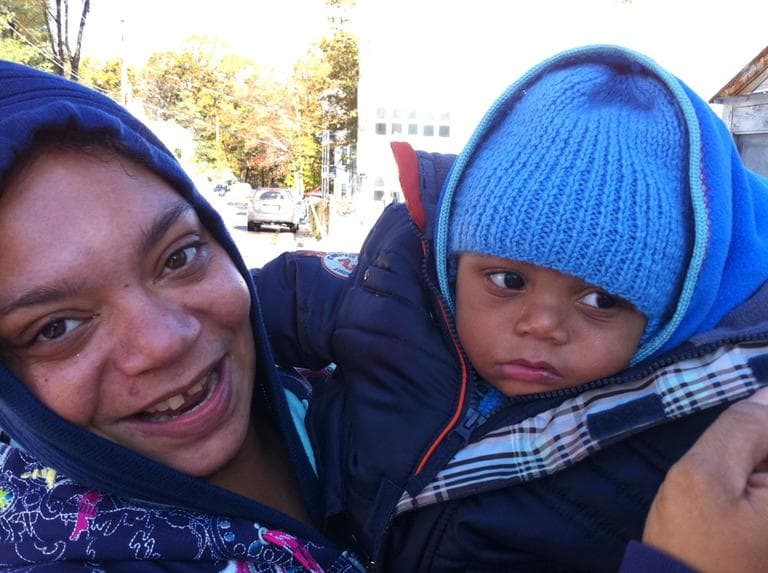 Aretha and Joshua Cotton outside their apartment in Fitchburg. The power went out at 1 a.m. Sunday, and they don't have a generator. (Bianca Vazquez Toness/WBUR)