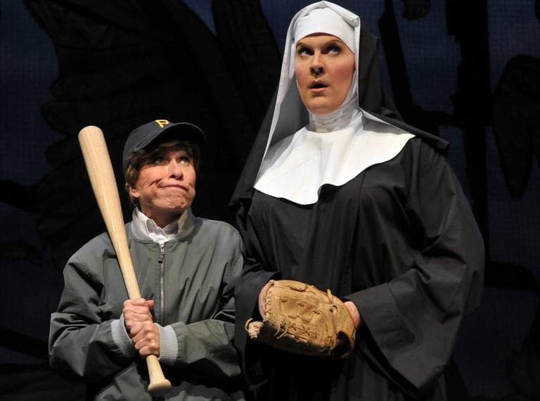 A young boy (Ellen Colton, left) turns to the Mother Superior (Jeffery Roberson aka Varla Jean Merman, right) for help with his baseball skills in a scene from the SpeakEasy Stage Company production of "The Divine Sister," running now thru Nov. 19. (Courtesy of Craig Bailey/Perspective Photo) 