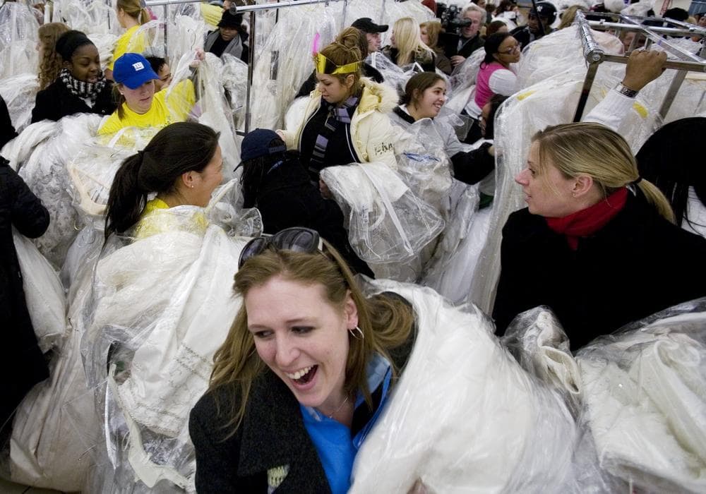 Brides-to-be and their friends join in the "Running of the Brides" at Filene's Basement in 2008, in New York. The department store chain held this annual Bridal Gown Event so brides-to-be can save hundreds, even thousands of dollars on designer wedding gowns. (AP)
