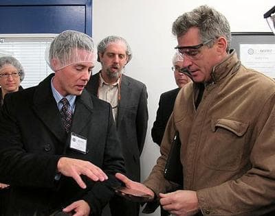 Sen. Scott Brown receives a tour of New Bedford's North East Silicon Technologies from President Rob Weeks, left. (Nick Fountain for WBUR)