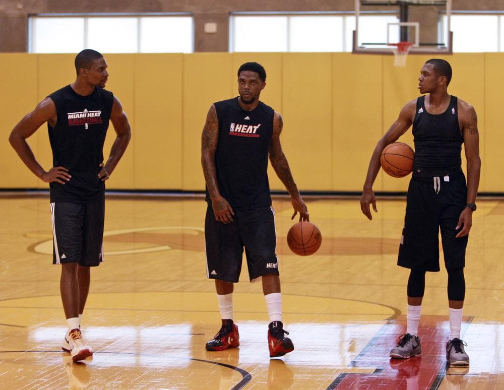Miami Heat forwards Chris Bosh, Udonis Haslem, and James Jones chat during a voluntary workout on Thursday in Miami. (AP)