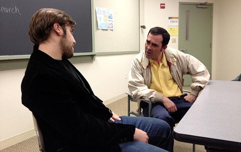 Jeremy Lee as Jackie Brown (left) and Paulo Branco as Eddie Coyle (right) rehearsing a new stage version of "The Friends of Eddie Coyle." (Adam Ragusea/WBUR)
