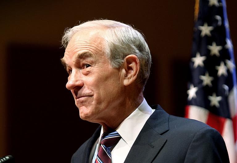 Republican presidential candidate Rep. Ron Paul, R-Texas, listens to a group chanting "We are the 99%" during a town hall meeting in Keene, N.H., Monday, Nov. 21, 2011.  (AP)