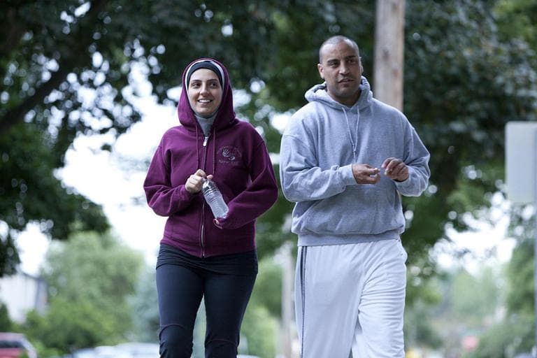 In this undated image provided by Discovery, Nawal Aoude, a pediatric respiratory therapist, left, and her husband Nader go for a walk in a scene from the TLC series, "All-American Muslim." The series features five families from Dearborn, Mich., a city near Detroit with one of the highest concentrations of Arab descendants in the country. (AP)