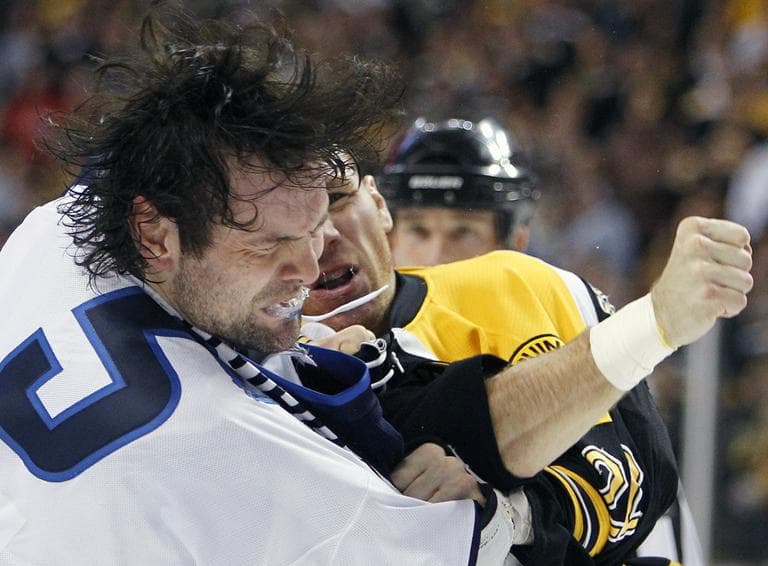 Boston Bruins' Shawn Thornton, rear, lands a punch on Winnipeg Jets' Mark Stuart (5) in the second period of an NHL hockey game in Boston, Tuesday. (AP)