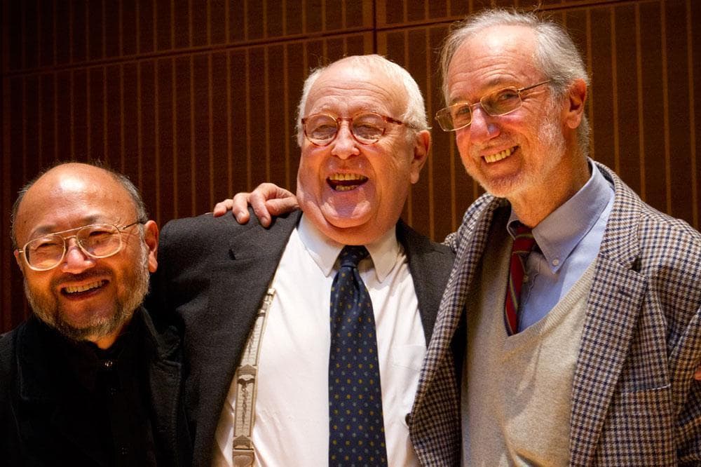 From left: Acoustician Yasu Toyota, museum music director Scott Nickrenz and architect Renzo Piano celebrate the unveiling Wednesday. Toyota and Nickrenz collaborated on designing the museum's new concert hall. (Jesse Costa/WBUR)